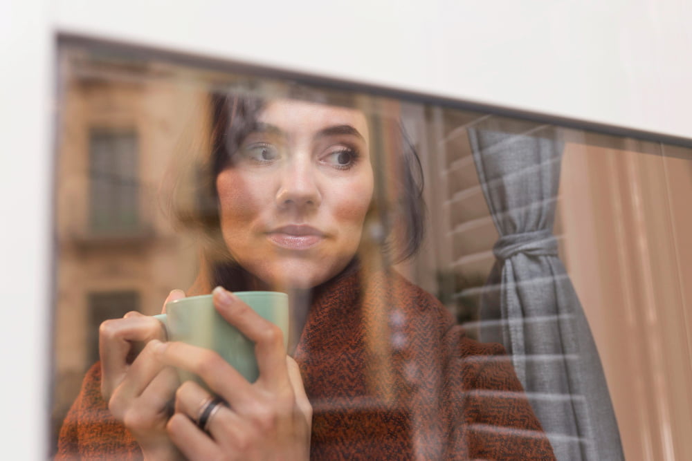 person reflecting window